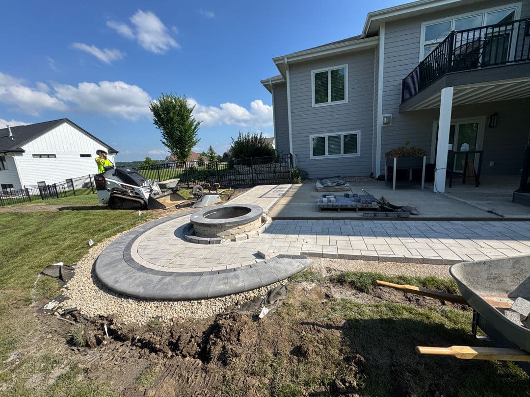 Gallery photos for Paver Patio Extension and Fire Pit Built to Handle a Sloped Backyard: Image #1